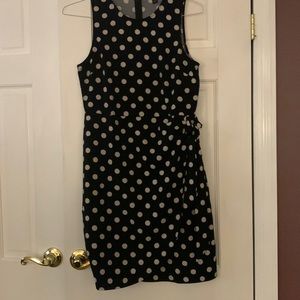 Black dress with beige polka dots. Bottom wrap with a tie on left side